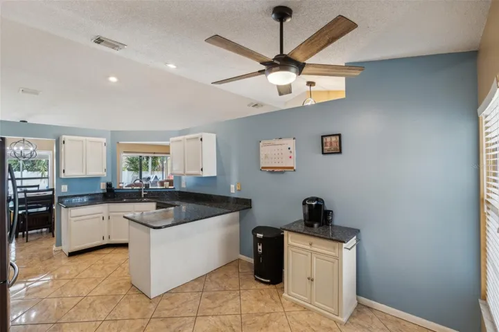 Kitchen with Breakfast Bar and Granite Counters