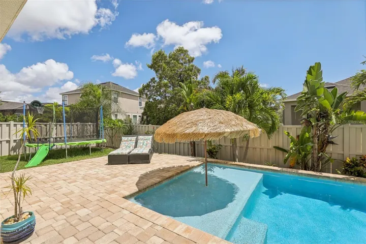 Pool with sunshelf for lounging and tanning