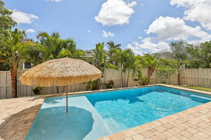 Pool with sunshelf for lounging and tanning
