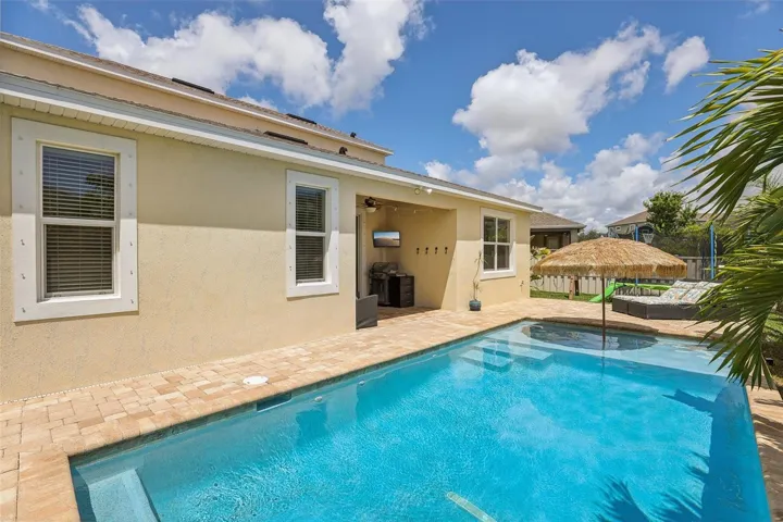 Pool with sunshelf for lounging and tanning