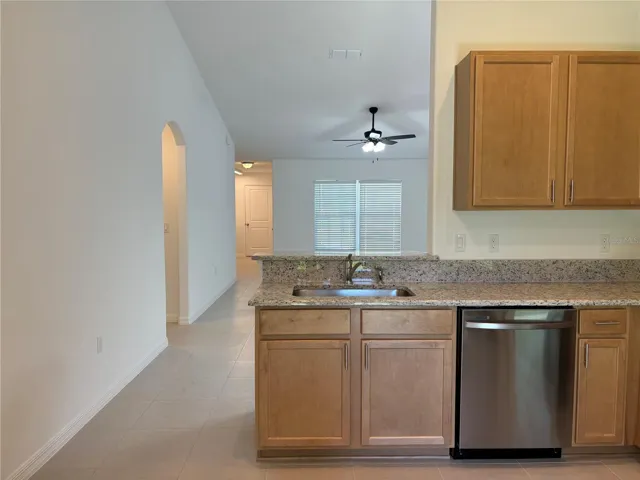 The brand new kitchen with granite countertops and stainless appliances