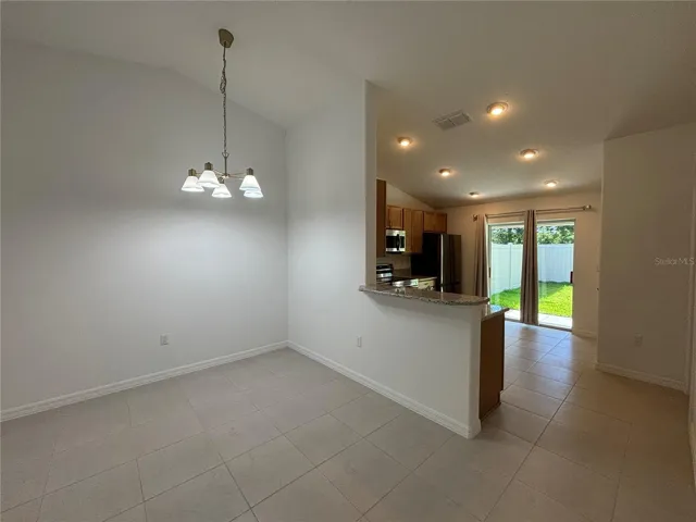 Bright and open living and dining room has loads of natural light.