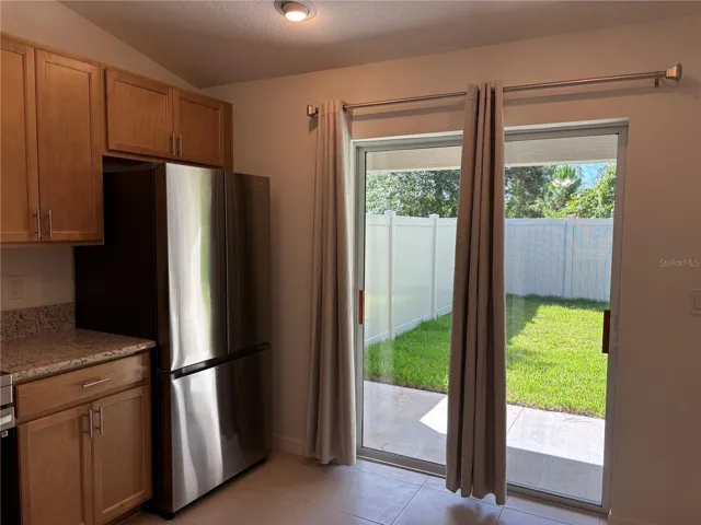 The brand new kitchen with granite countertops and stainless appliances