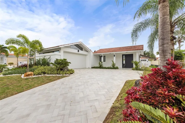 Completely remodeled property with all new windows and doors. Beautifully paved driveway leads to the Two Car Garage.