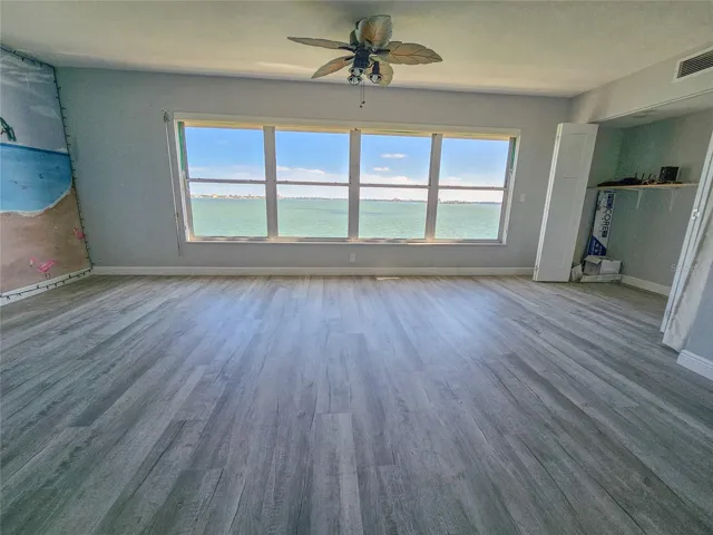 Florida Room Area Off of Living Room Area w/ Full Bay Views!