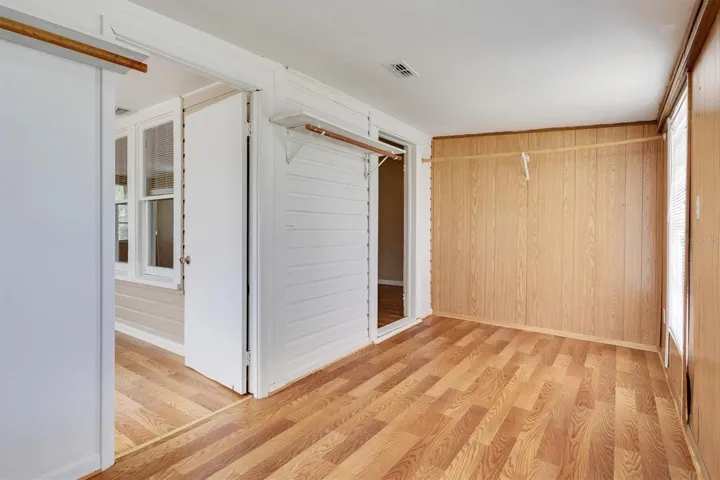 Owners Walk In Closet & Access to Front Sunroom