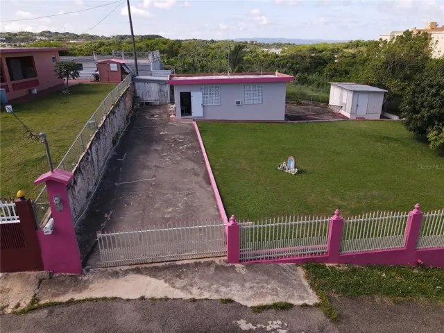 2 lots with a small concrete house sold together