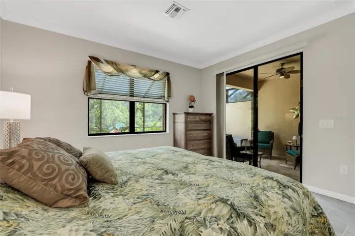 Master Bedroom Large Glass Sliders onto Pool Lanai