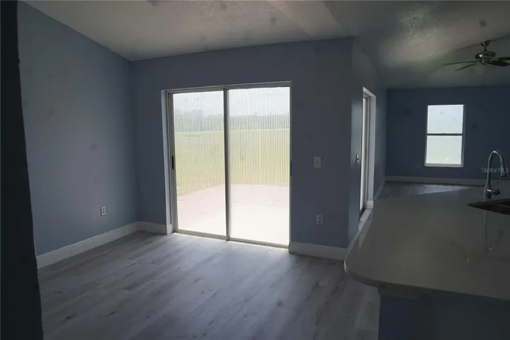 dining room looking from kitchen area, glass door to outside rear of house