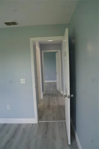 looking from back bedroom (#3) along the corridor towards the front bedroom (#2)