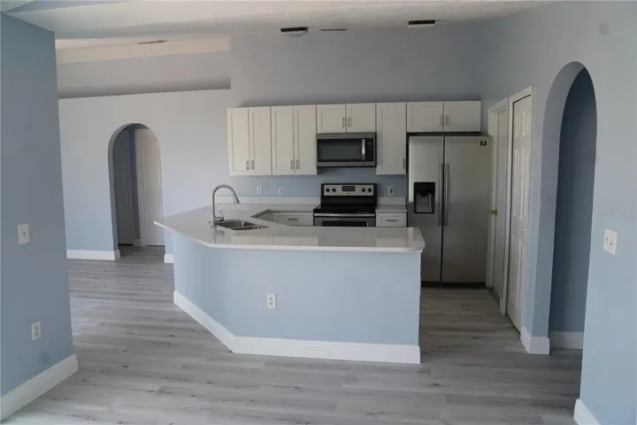 looking at kitchen from dining area