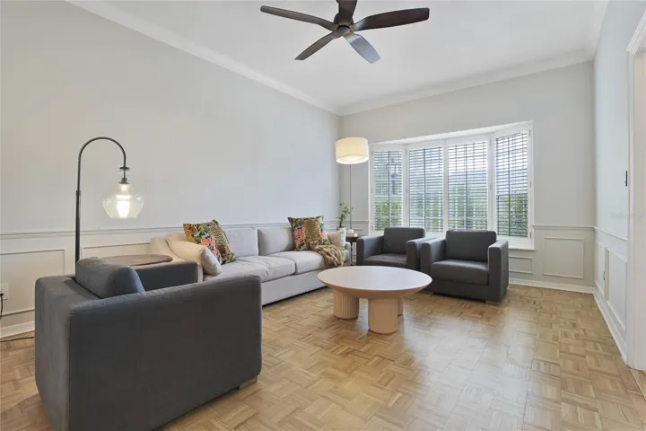 Living room with bay window seat/plantation shutters