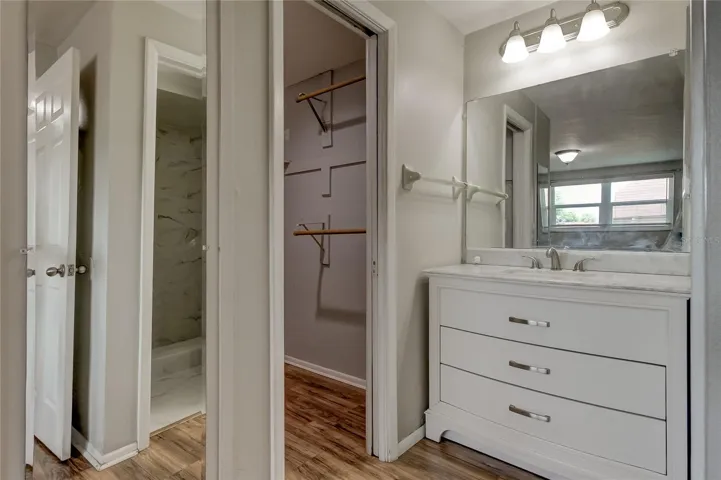 en-suite primary bathroom with large walk in closet