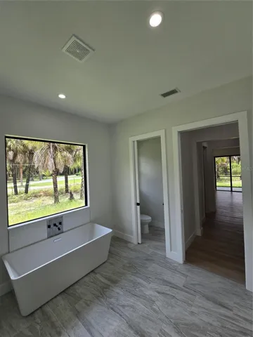 Soaking Tub & Toilet Room