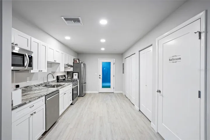 Granite countertops and luxury vinyl throughout.