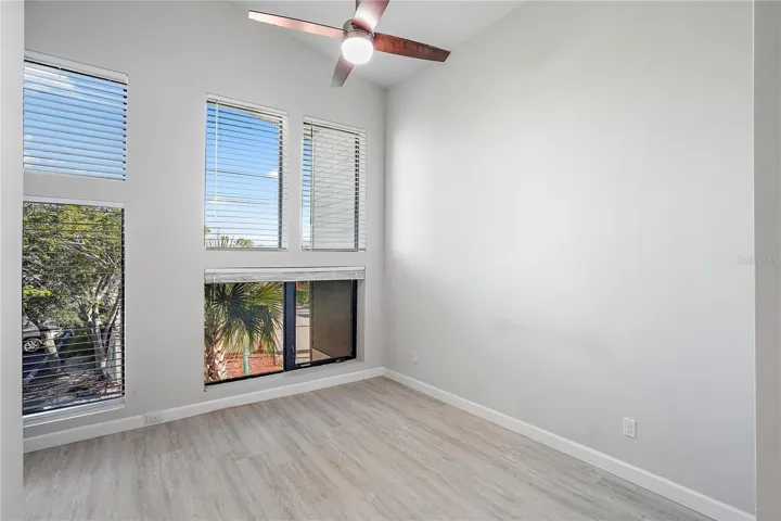 Bright owner's suite with tall ceilings.