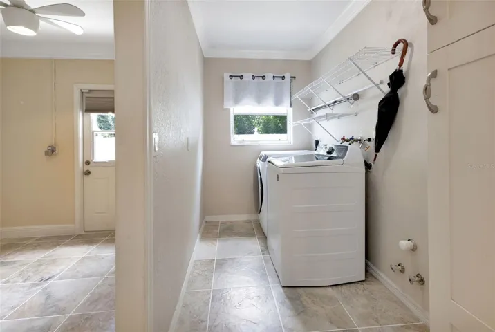 Inside laundry room off of kitchen. Washer and dryer included and pantry cabinets.
