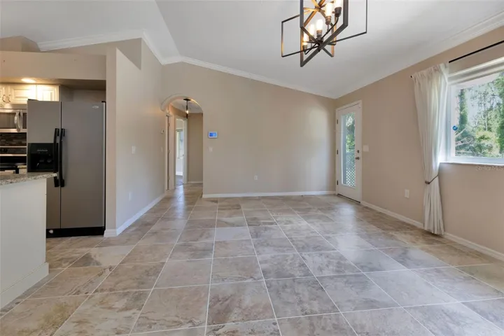 Living room opens up to kitchen and dining area