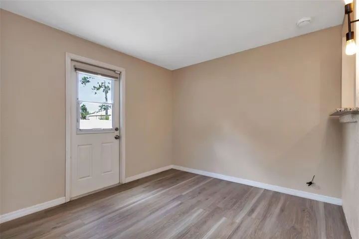 Florida room off of kitchen great place for a dining room with access to backyard.