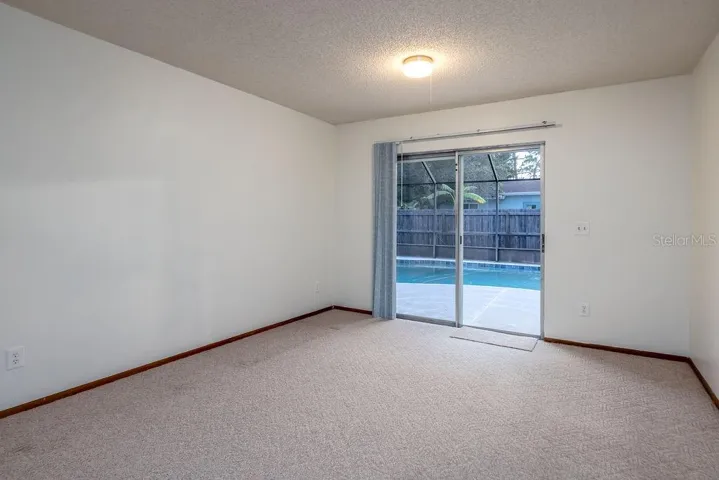 Large Dining Area with sliders and amazing view to POOL!