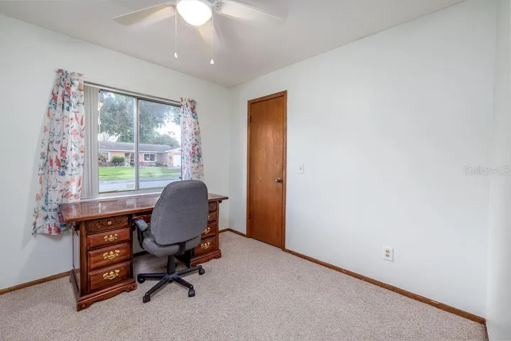3rd bedroom w walk-in closet and new ceiling fan w light fixture