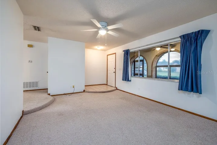 Living room: Fresh Paint, New ceiling fan & light fixtures, and 2 storage closets, and large window with great views!
