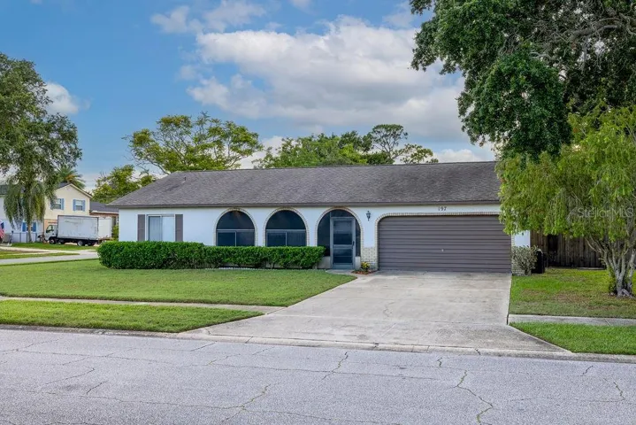 Concrete Block 3 bedroom, 2 bath, 2 car garage!
