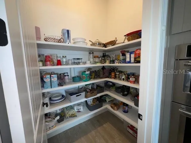 New wood built-in shelves in kitchen pantry.