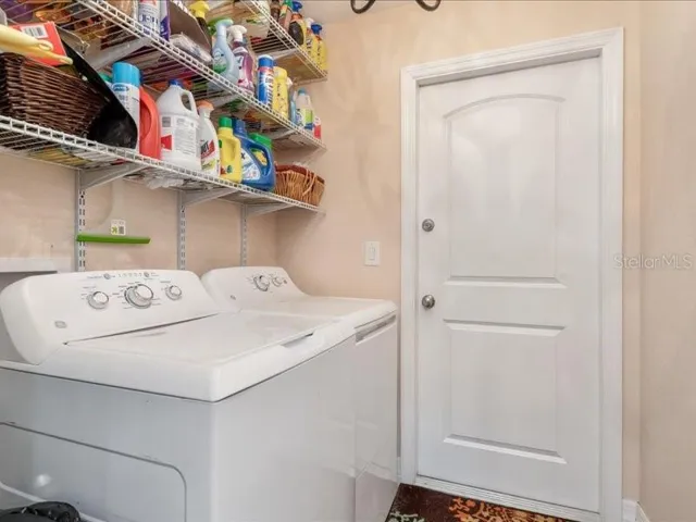 Washer and dryer in laundry room convey.