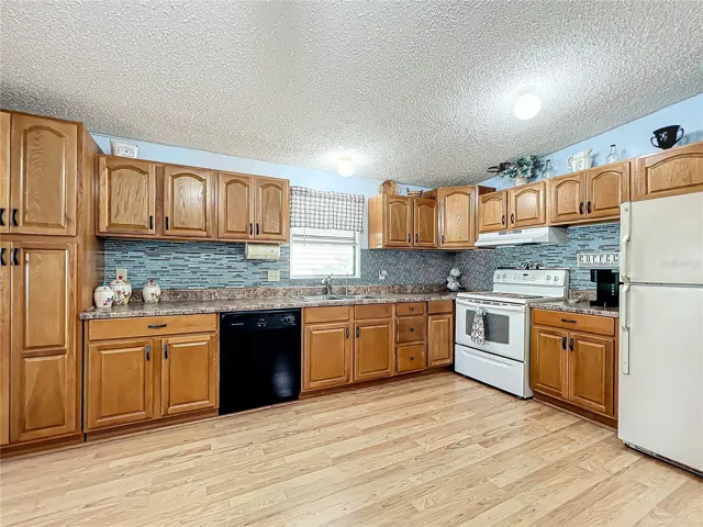 Spacious kitchen with updated backsplash