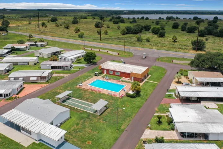 Aerial of the shuffleboard, heated pool and clubhouse