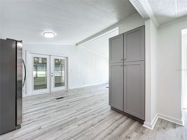 Kitchen and double doors to the front room