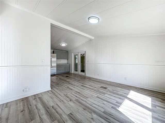 Living room with view into the kitchen