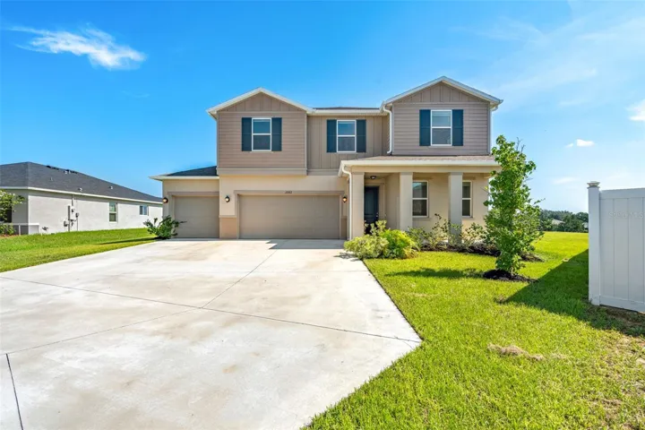 Welcoming entrance with large driveway