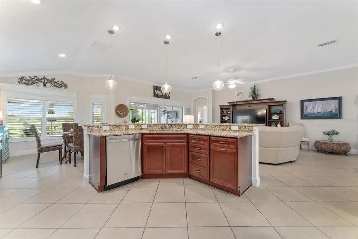 VIEW TO GOLF AND LAKE FROM KITCHEN AREA.