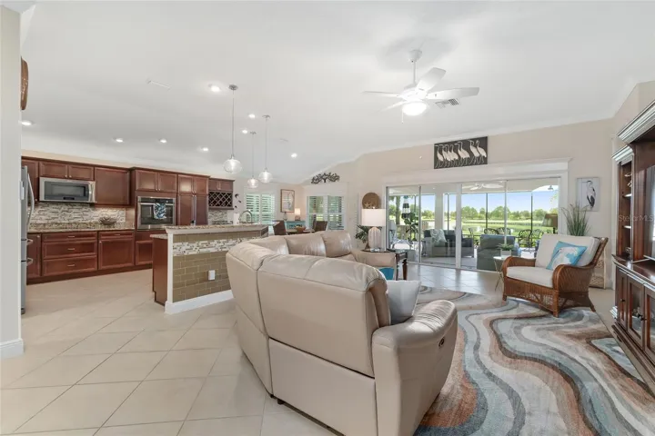 RECLINING LEATHER SECTIONAL, CHAIR AND RUG REMAIN WITH THE HOME. VIEW TO THE GOLF COURSE.