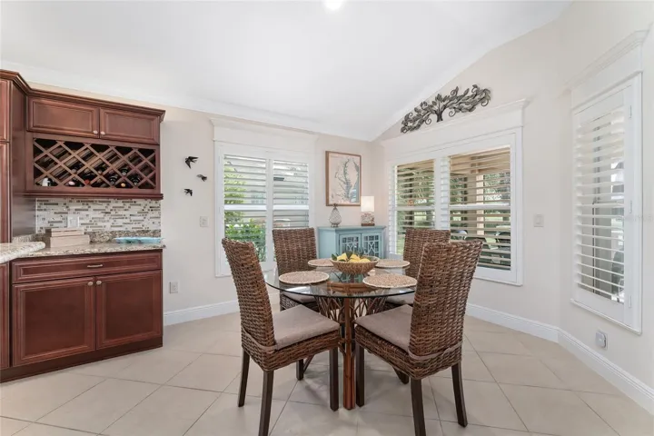 BREAKFAST AREA WITH MULTIPLE WINDOWS OFFERING VIEW TO GOLF COURSE. ALL FINISHED WITH PLANTATION SHUTTERS, TRIM AND CROSSHEADS.