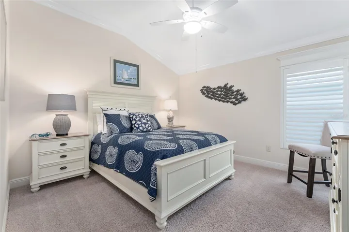 SECOND GUEST ROOM HAS VAULTED CEILING, NICELY FINISHED WITH CROWN MOLDING, PLANTATION SHUTTERS, CROSSHEAD AND LIGHTED CEILING FAN.