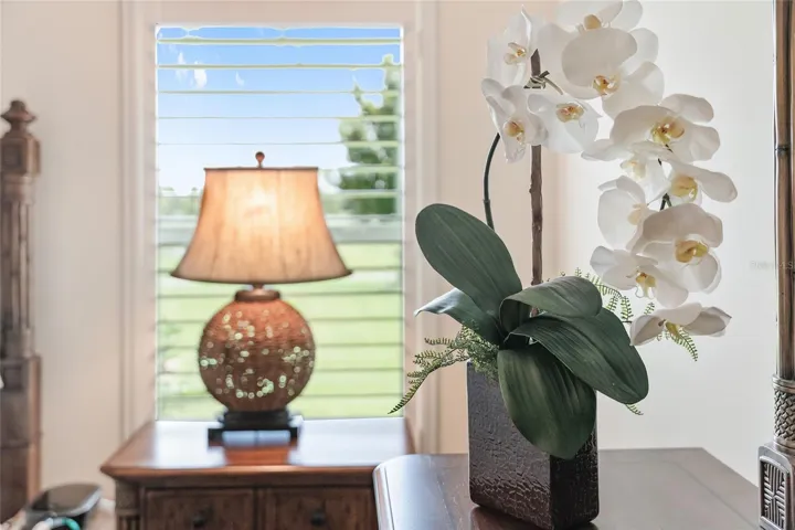 PLANTATION SHUTTERS OFFER AMPLE NATURAL LIGHT IN PRIMARY SUITE AND THROUGHOUT THE HOME