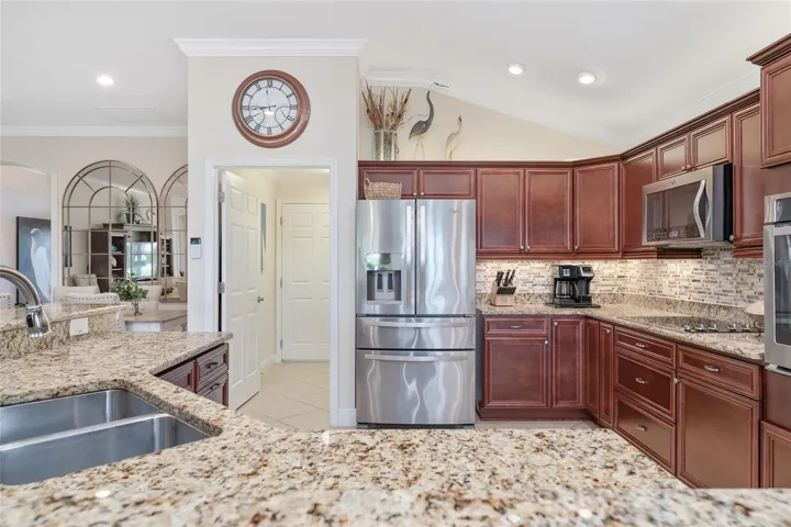 ACCESS TO LAUNDRY ROOM AND GARAGE FROM KITCHEN.