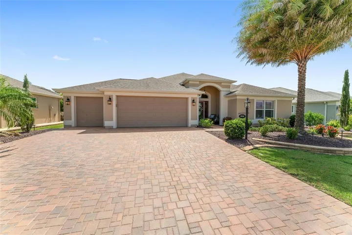 PAVER DRIVEWAY, GUTTERS ALL AROUND HOME, GOLF GARAGE