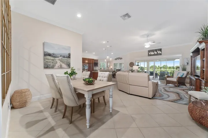 VIEW THROUGH DINING AREA AND LIVING AREA TO GOLF AND LAKE