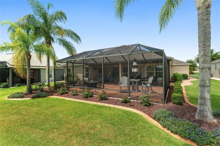 REAR OF HOME, BIRDCAGE AND COVERED LANAI.