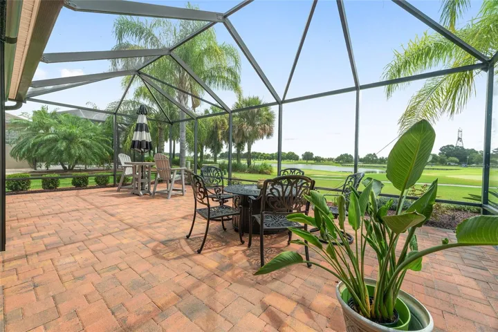 PATIO WITH BIRDCAGE OFFERS GREAT SPACE FOR SUNNING, DINING, WATCHING THE GOLFERS, ENJOYING THE LAKE OR VIEWS TO WEICHENS PRESERVE. LEFT TOP SHOWS REMOTE SCREEN AT TOP.