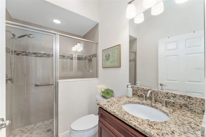THIRD BATHROOM WITH GLASS ENCLOSED WALK IN SHOWER.