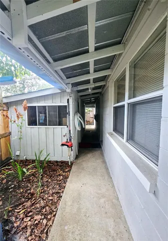 Outdoor laundry, workshop, and storage room on the left.