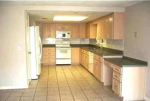 Owner's photo of kitchen before moving in.