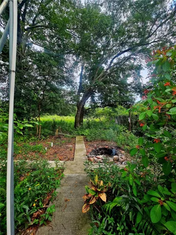 View towards the pond and firepit.