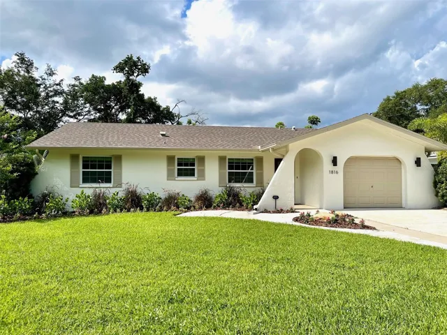 Beautifully landscaped and extremely well maintained both inside and out!