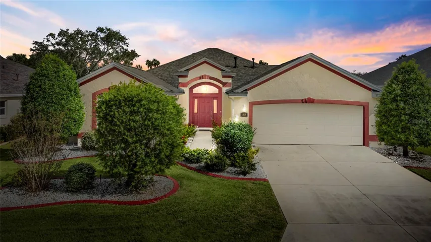 Welcome home to this designer extended Lantana home nestled between 466 and 466a in The Villages, FL